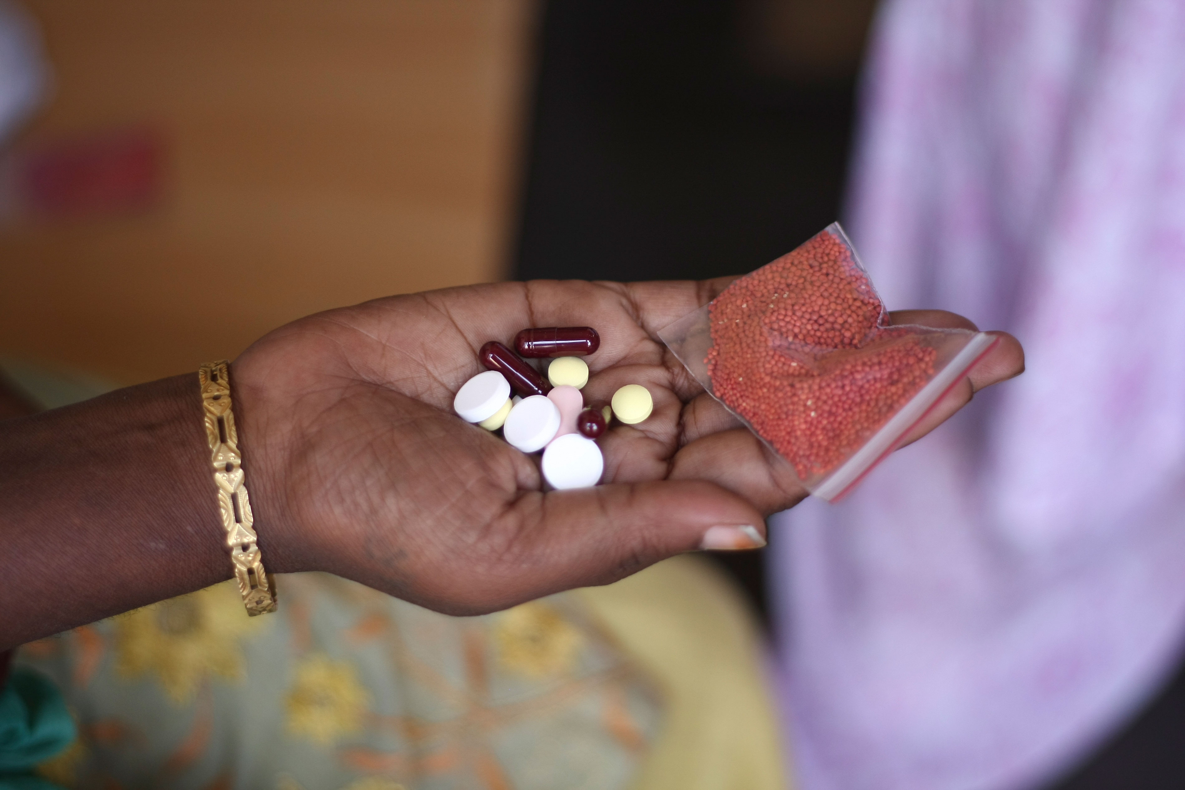 Shanti (name changed) is a 38 year old semi-literate woman living in Mumbai. She has been living with HIV and multidrug resistant tuberculosis (MDR-TB) for the past 5 years. Here, she displays her daily dosis of medication. Photograph by Bithin Das