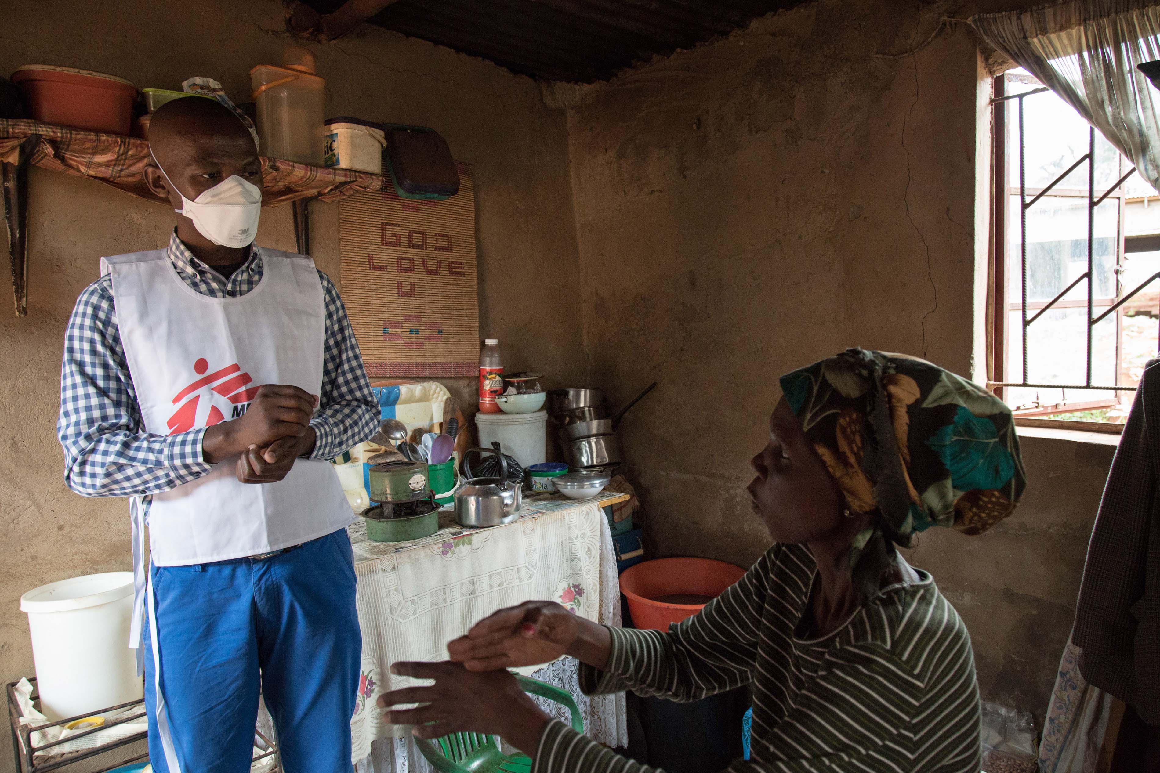 Celumusa Hlatswako, an MSF mobile counsellor, visits Winile, an XDR-TB patient, at home in Manzini Region, Swaziland. 