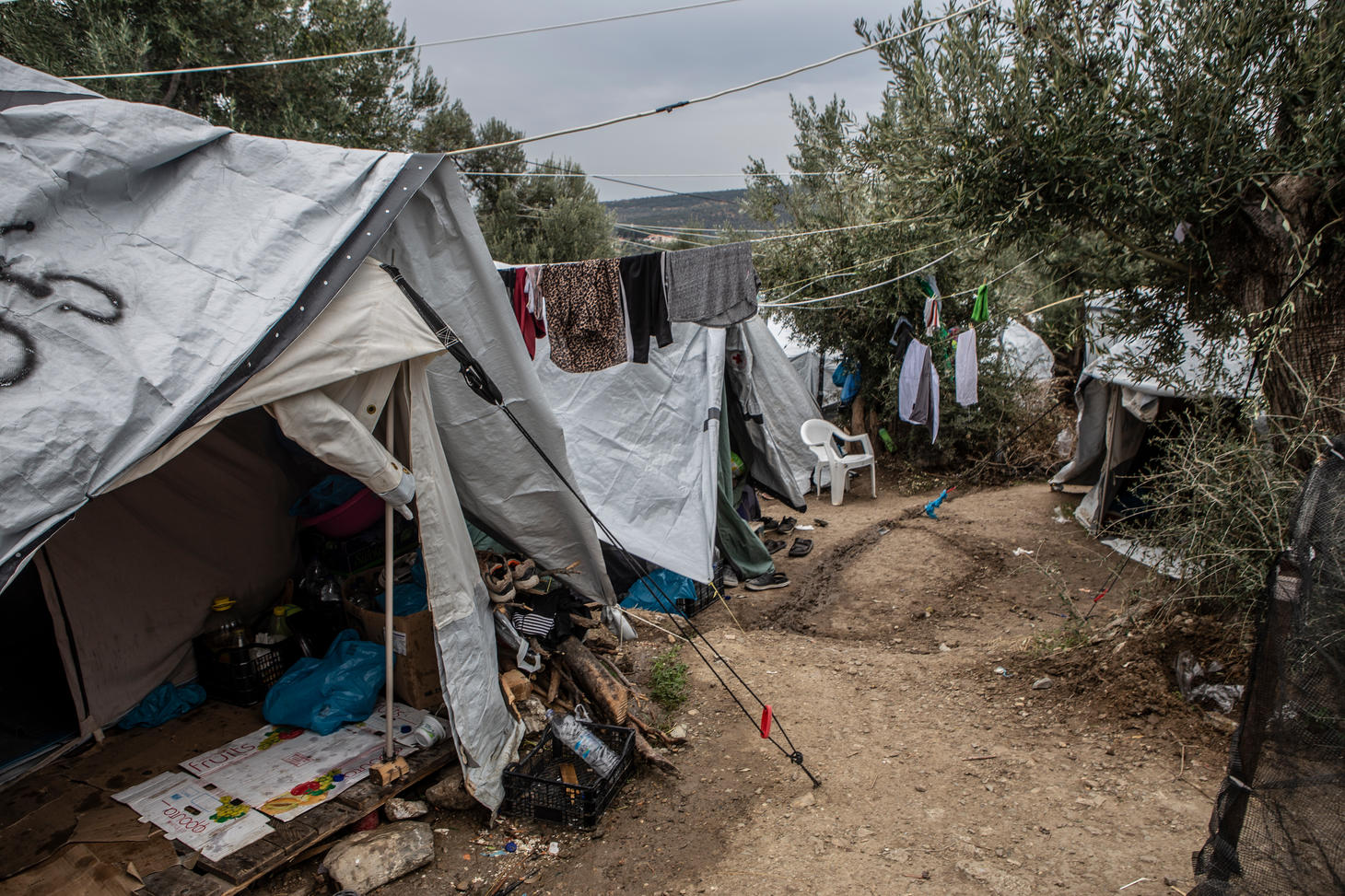 A general view of the olive grove next to the official camp of Moria. At the moment, 13,000 people stranded in a camp designed to host just 3,000. People in the olive grove have to share their tents with other people with whom, they don’t have any previous relationship. The level of hygiene is very low and people have to share a toilet with another 90 people and a shower with 200. When it rains the tents are getting wet and the area turns into a muddy swamp.