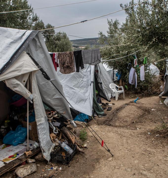 A general view of the olive grove next to the official camp of Moria. At the moment, 13,000 people stranded in a camp designed to host just 3,000. People in the olive grove have to share their tents with other people with whom, they don’t have any previous relationship. The level of hygiene is very low and people have to share a toilet with another 90 people and a shower with 200. When it rains the tents are getting wet and the area turns into a muddy swamp.
