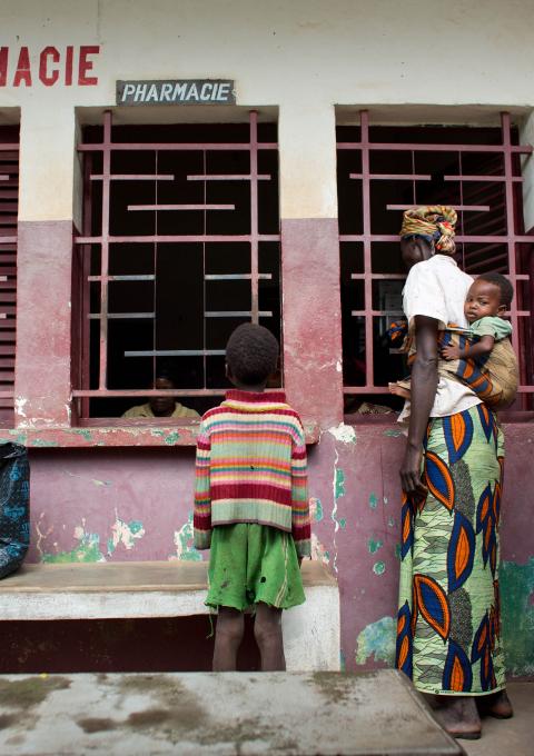 A group of mothers with their children line up to receive their drugs at a hospital pharmacy in Bossangoa, in the northwest region of the Central African Republic, June 2013.