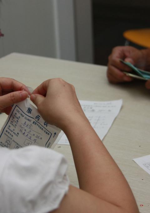 An MSF national doctor consults with an HIV patient in the MSF/CDC clinic in Nanning, Guangxi Province, southwest China in July 2010