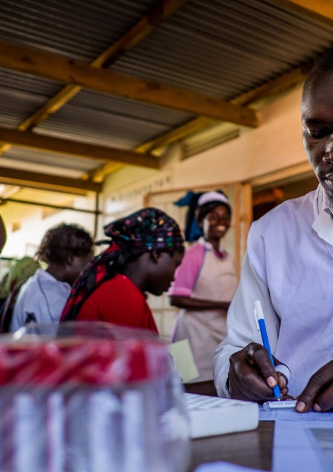 Fred is preparing the labels for the blood samples, at the HIV department of Arua Regional hospital-Uganda
