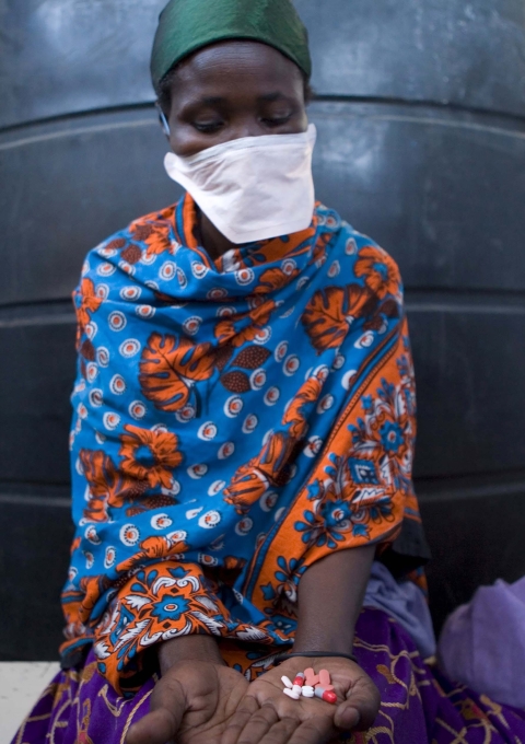 Monica, infected with both HIV and multi-drug-resistant tuberculosis, or MDR-TB, is taking her drugs. She receives treatment through Blue House, a clinic on the edge of Mathare, one of the Kenyan capital Nairobi's more violent slums, where MSF treats people with TB and HIV.