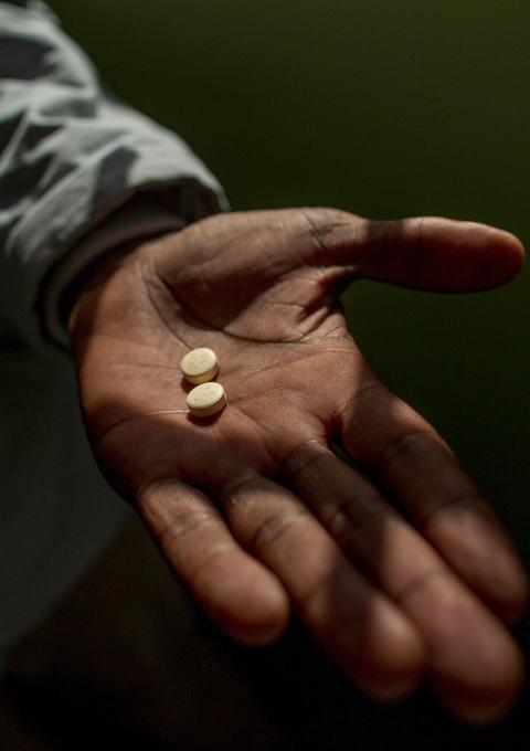 Simphiwe holds his first delamanid tablets, which have now been included into his treatment regimen for XDR-TB, October 2016.