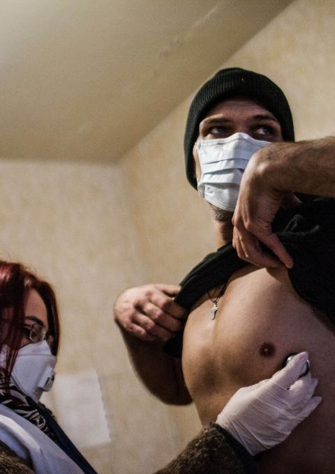A patient infected with TB is treated by a member of MSF staff within a prison in Donetsk, Ukraine, where MSF is helping to treat patients infected with TB. 