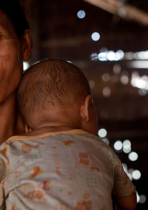 Ma Htwe Myint, 38, holds her 16 month old baby Thar Nge. He is co-infected with HIV and TB.