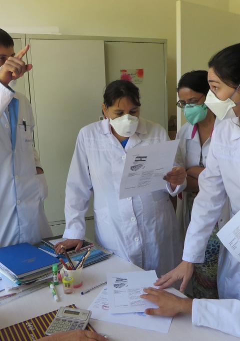 Medical activity manager explaining TB medication and usage