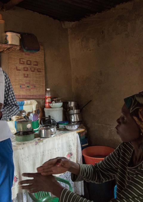 Celumusa Hlatswako, an MSF mobile counsellor, visits Winile, an XDR-TB patient, at home in Manzini Region, Swaziland. 