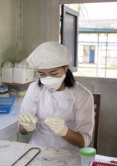 MSF staff member Nant Poe Ou performs an initial screening of a sputum sample for the presence of mycobacterium tuberculosis at MSF's Insein clinic in Yangon, Myanmar, Feb. 22, 2018.