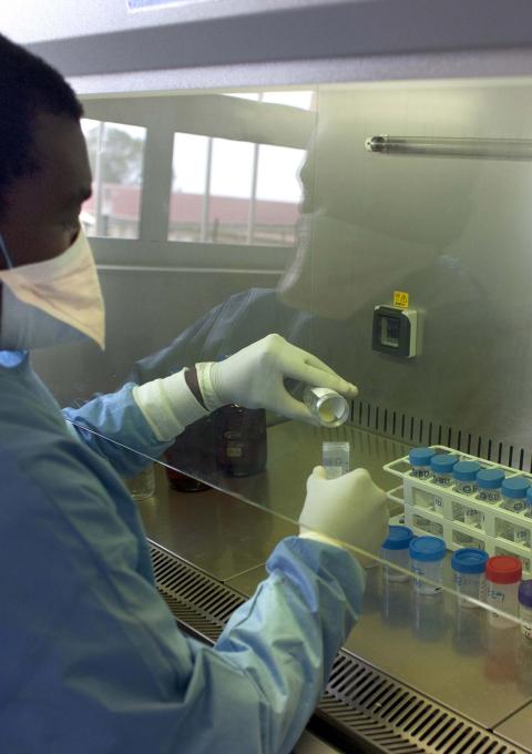 MSF lab technician working in the lab at the Nhlangano TB ward in Shiselweni, Swaziland. Photograph by Giorgos Moutafis