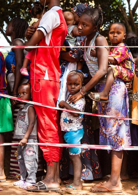 Children queue at a vaccination point in the commune of Matoto, Conakry, Guinea. Médecins Sans Frontières/Doctors without Borders (MSF) is launching a large scale measles vaccination campaign in Conakry, the capital of Guina. Since the beginning of the year there have been 3468 confirmed cases and 14 deaths dues to measles in Guinea. Conakry and Nzérékoré are the most affected districts. Photograph by Markel Redondo