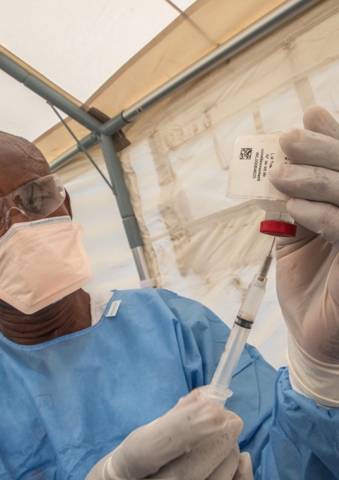 Nurse preparing the Ebola vaccine in the site of Bikoro
