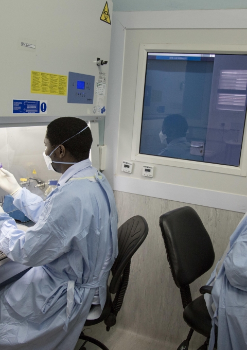 Lab technologists preparing sputum samples to realize bacteria cultures. Kwanele Dlamini (left), MSF Lab Technologist, & Nobuhle Matsabula (right), MoH Microscopist. National TB Reference Laboratory , Government Hospital, Mbabane, Swaziland.