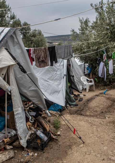 A general view of the olive grove next to the official camp of Moria. At the moment, 13,000 people stranded in a camp designed to host just 3,000. People in the olive grove have to share their tents with other people with whom, they don’t have any previous relationship. The level of hygiene is very low and people have to share a toilet with another 90 people and a shower with 200. When it rains the tents are getting wet and the area turns into a muddy swamp.