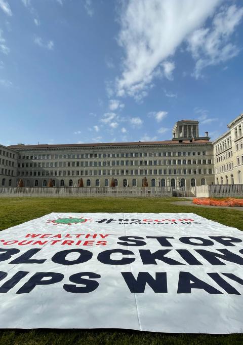Banner deployed by MSF in front of the World Trade Organization (WTO) in Geneva calling on certain governments to stop blocking the landmark waiver proposal on intellectual property (IP) during the pandemic.