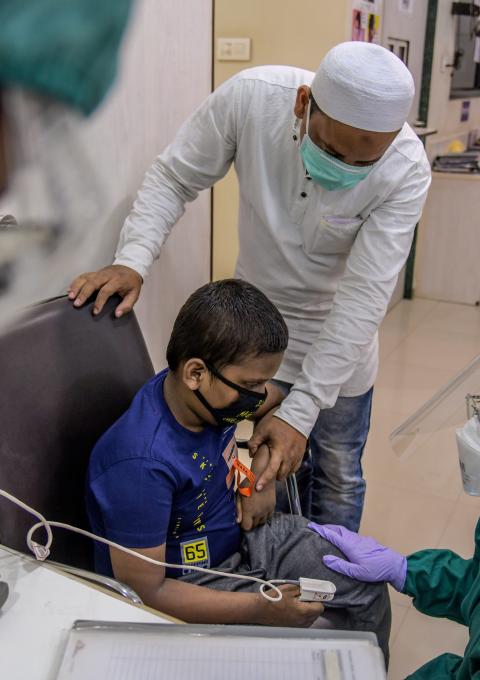MSF Nurse taking vitals of nine years old XDRTB + EPTB male child at MSF independent Clinic, Mumbai- India