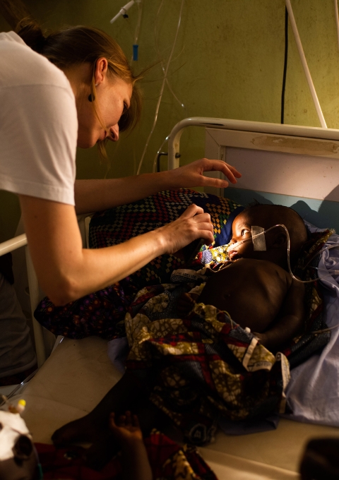 MSF Medical Doctor Valerie Weiss taking care of a young patient suffering from meningitis at the High Dependency Unit of the MSF pediatric ward at Anka General Hospital.
