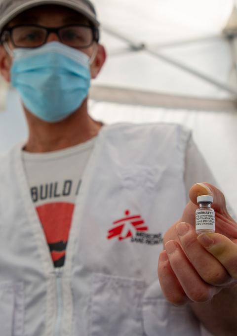 Jérôme TOGNOTTI, MSF nurse supervisor, is holding a vial of the Covid-19 vaccine used by the teams to vaccinate homeless and migrants people