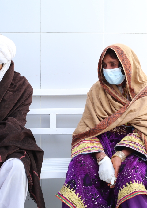 Bibi Shahisto waits to see the doctor with her son on the women's side of the Médecins Sans Frontières (MSF) drug-resistant tuberculosis (DR-TB) hospital in Kandahar city, Kandahar Province, Afghanistan. Photo credit: Lynzy Billing