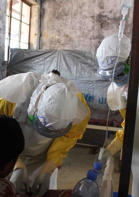 Medical staff providing treatment in MSF-supported Bolomba Ebola treatment center, Equateur province, DRC, August 2020