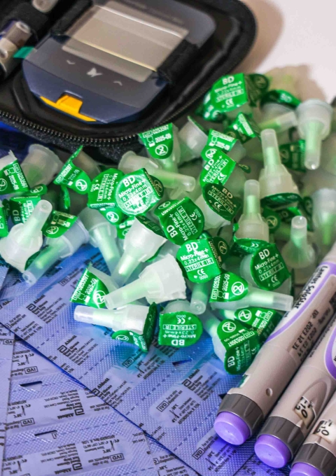 A collection of insulin pens and needle caps beside a glucometer at the MSF clinic in Arsal, north Lebanon, where MSF re-introduced insulin pens as part of its free medical care for people living with type 1 diabetes.