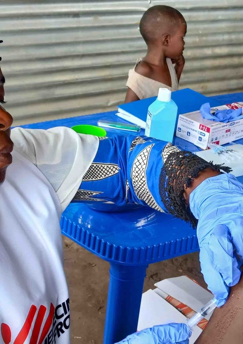 A child receives measles vaccine at the Musenyi refugee site. 8,500 refugee children aged 6 months to 14 years were targeted for the vaccination campaign at the Musenyi site.