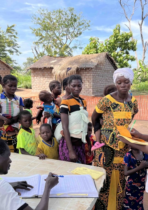 Mothers wait patiently with their children at a vaccination site in Mala, where MSF supports the Ministry of Health to strengthen routine immunization services.