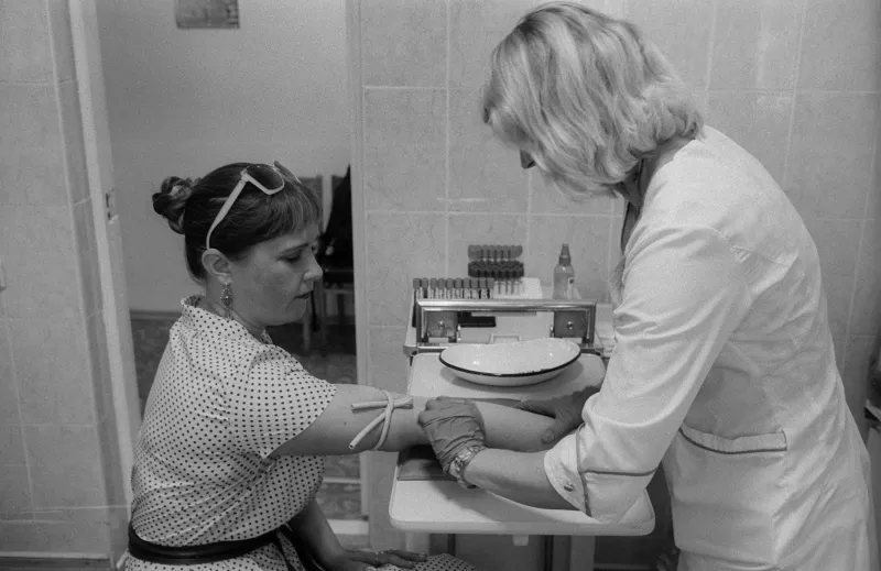 Olena Melnikova, taking a viral load test in the process of hepatitis C treatment, Ukraine, 2018.