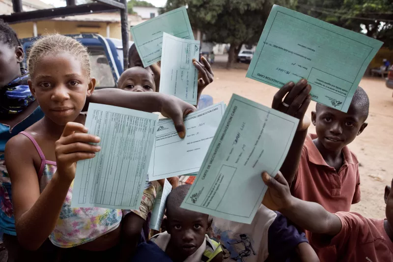 Children show their vaccination cards at the Betsaida health center in Lubumbashi, Feb. 11, 2011.