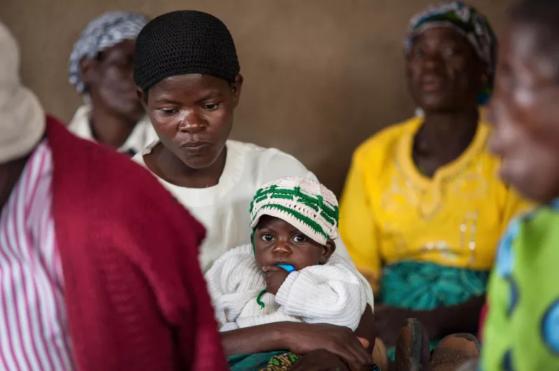 A woman and child at the support group meeting in remote village of Chidothe, Thyolo District, Malawi 2013.