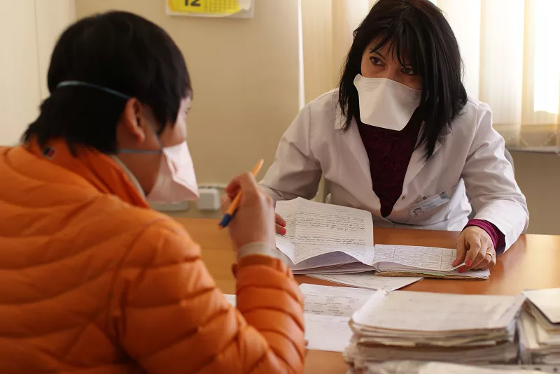 MSF TB doctor consults with MoH doctor about problematic DRTB cases requiring MSF attention. At the heart of MSF's programme is providing a complete package of care for DR-TB patients, including medical, social and psychological support.
