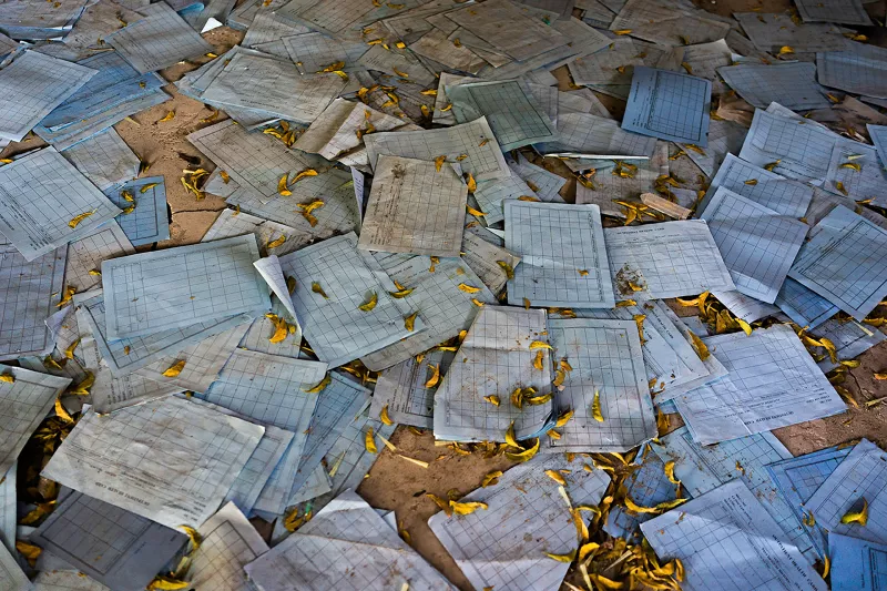 Medical charts lie scattered on the ground inside of the looted and abandoned MSF hospital in Leer, South Sudan. 
