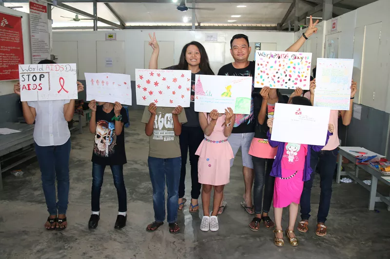 During a peer group activity at MSF’s Thaketa Clinic in Yangon , HIV+ Adolescents expressed their feelings by painting pictures and writing letters in anticipation of World AIDS Day 2016. Here with MSFers Zarni and Phu Phu from Yangon Project.