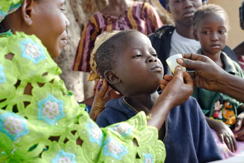 Kanda Konde is five years old and getting his first dose of malaria treatment in the village Deguela, in the Kangaba region of southern Mali, 2009.