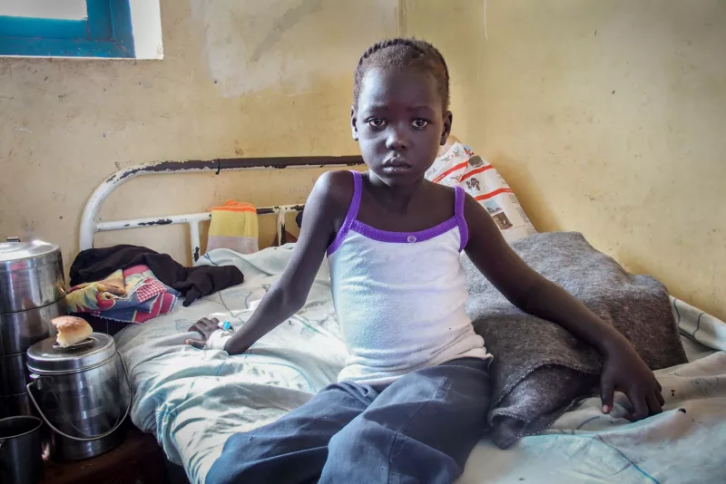 Bitten by a snake while she slept, six-year-old victim is resting at MSF hospital in Agok, 2015.