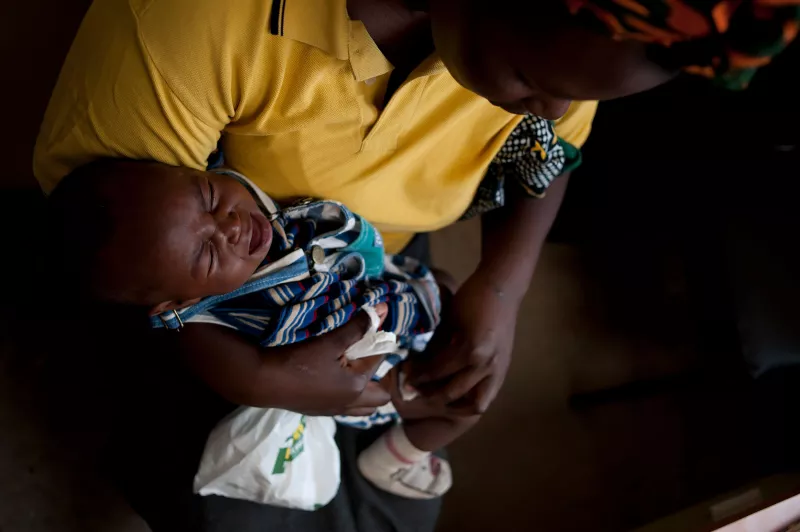 Child being vaccinated against pneumococcal disease in Silanga Hospital, Kibera Kenya 2011.