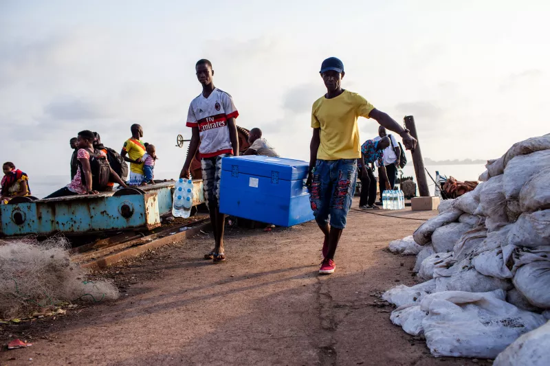 Measles vaccines being trasported by boat to the island of Kassa, a few miles away from Conakry, Guinea. Doctors without Borders (MSF) is launching a large scale measles vaccination campaign in Conakry, the capital of Guina. Since the beginning of the year there have been 3468 confirmed cases and 14 deaths dues to measles in Guinea. Photograph by Markel Redondo