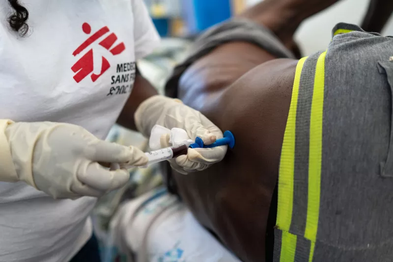 MSF staff performing a bone marrow biopsy on a suspected kala azar relapse patient. Bone marrow or spleen tissue laboratory analyses are the only accurate ways to determine the presence of kala azar in a suspected relapse patient. Ethiopia 2018.