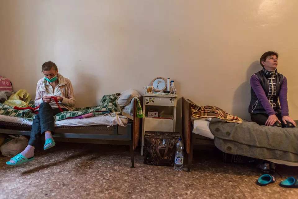 Oksana Kolodiuk, 39, and Nataliia Klymyk, 44, both have extensively drug-resistant tuberculosis (XDR-TB). Here they are sitting on their beds in the room they share at the Zhytomyr Regional TB Dispensary. 