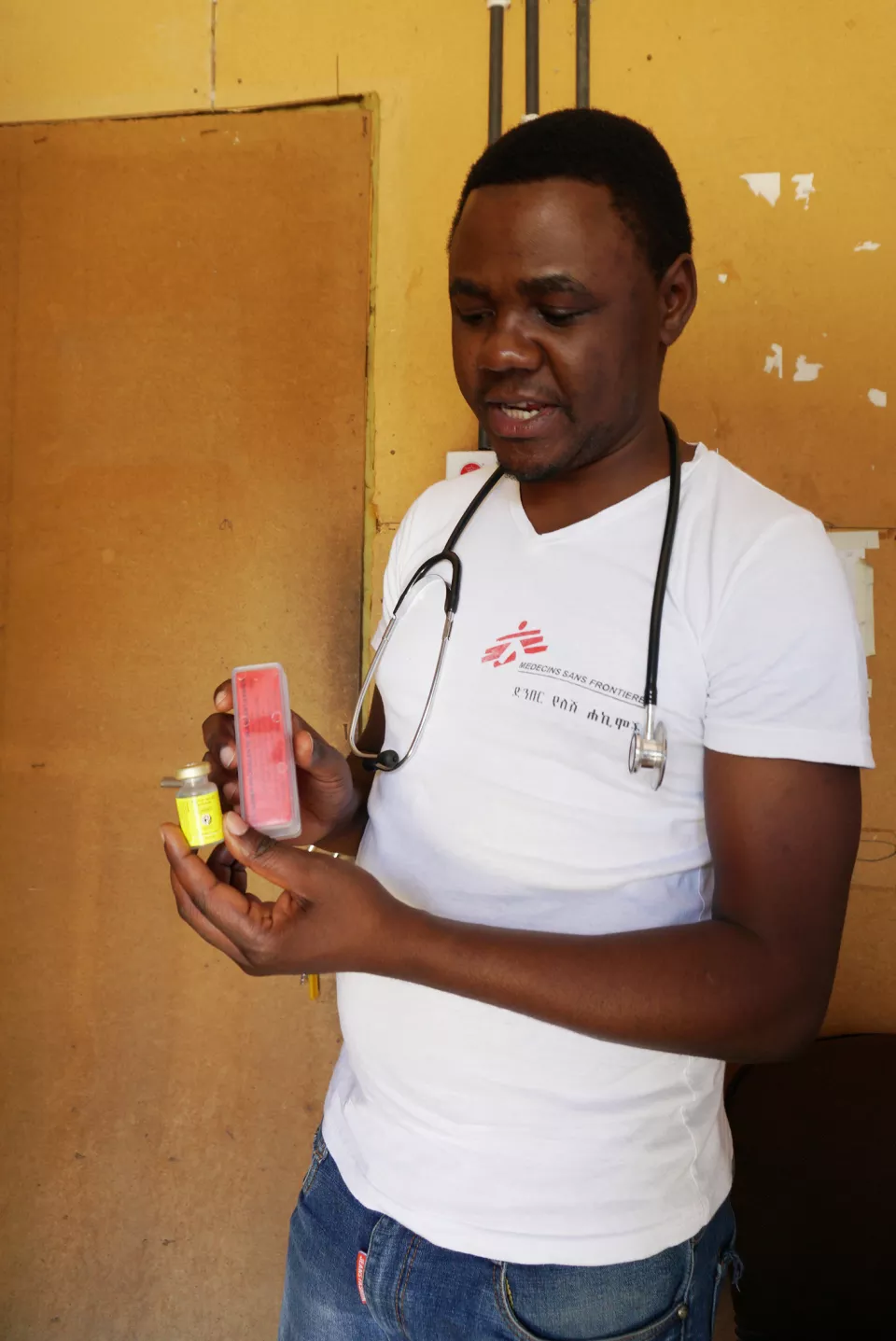Dr Ernest Nshimiyimana in the MSF pharmacy, checking MSF stock of anti-venom.