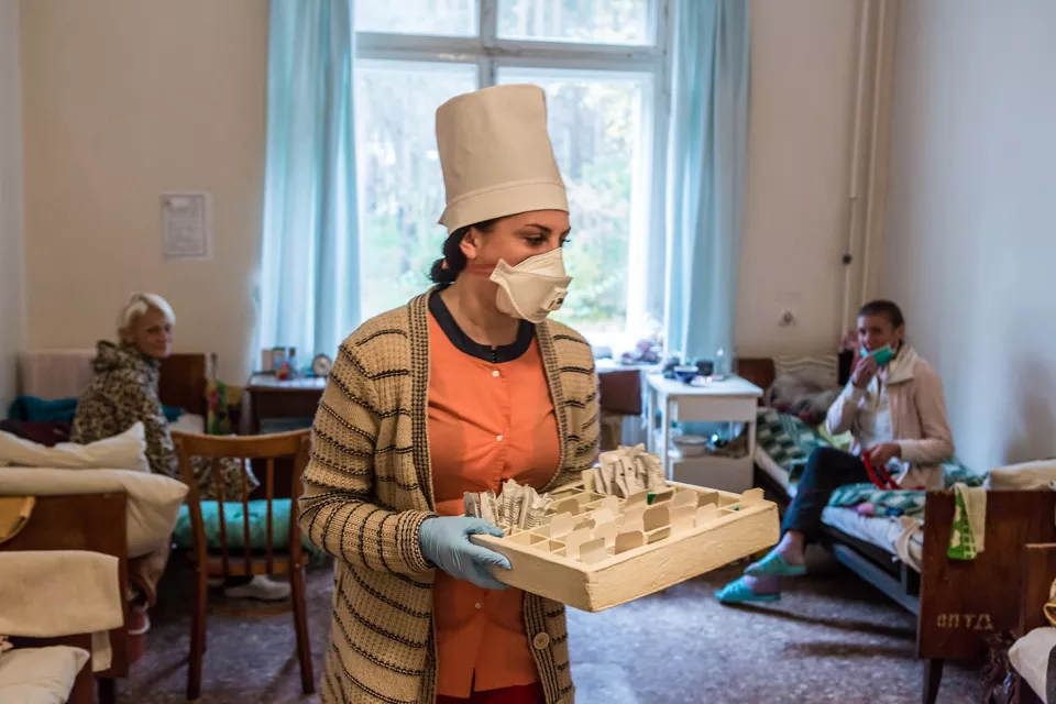 A Ministry of Health nurse distributes medication to patients with extensively drug-resistant tuberculosis (XDR-TB) at the Zhytomyr Regional TB Dispensary.