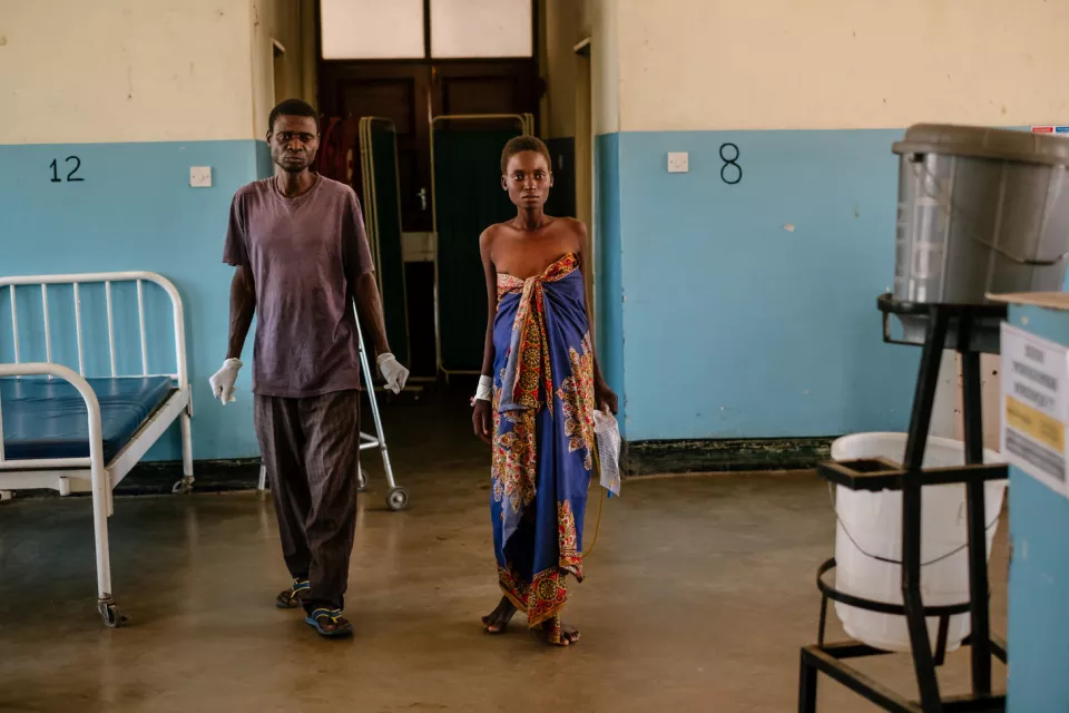 Gerald, Lita’s father walking Lita from the toilet in the female ward at Nsanje District Hospital. Lita Gerald is a 20 year old lady that is HIV positive with history of having challenges in adhering to treatment. Lita is someone who was once on ARV treatment then she had to disengage for two months before getting reengaged again through Nsanje District Hospital’s Rapid Assessment Unit (RAU).