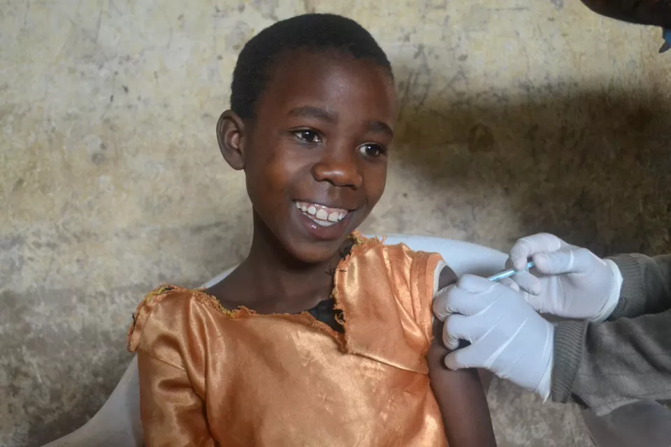 Vanessa, 9, receives her HPV vaccination at school. Chiradzulu district, Malawi.