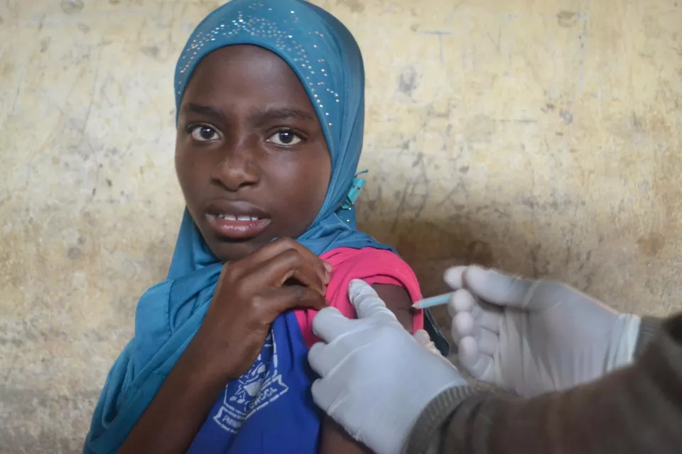 Shila, 9, receives her HPV vaccination at school. Chiradzulu district, Malawi.