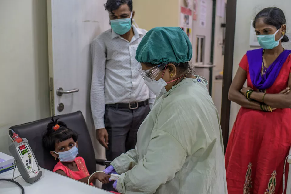 MSF Nurse taking vitals of six years old MDR-TB girl child at MSF independent Clinic, Mumbai- India