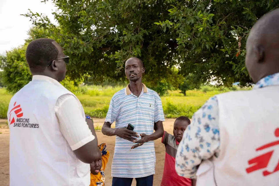 Aher’s father, Lual Aher, speaks to MSF staff at his home in Ariath, Aweil North. 