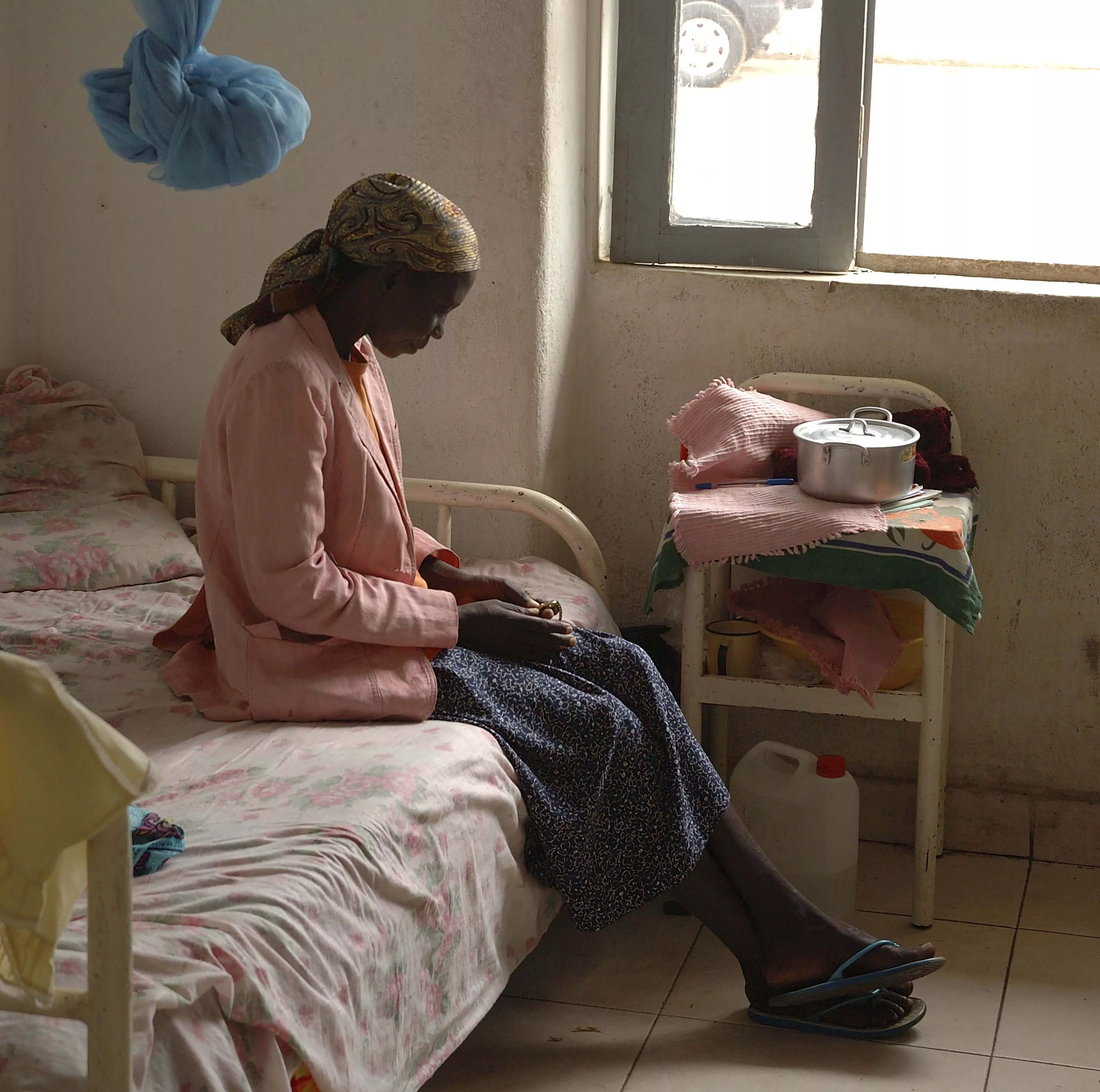 Patient in the women's ward of Kuito TB sanatorium, Central Angola 2004.