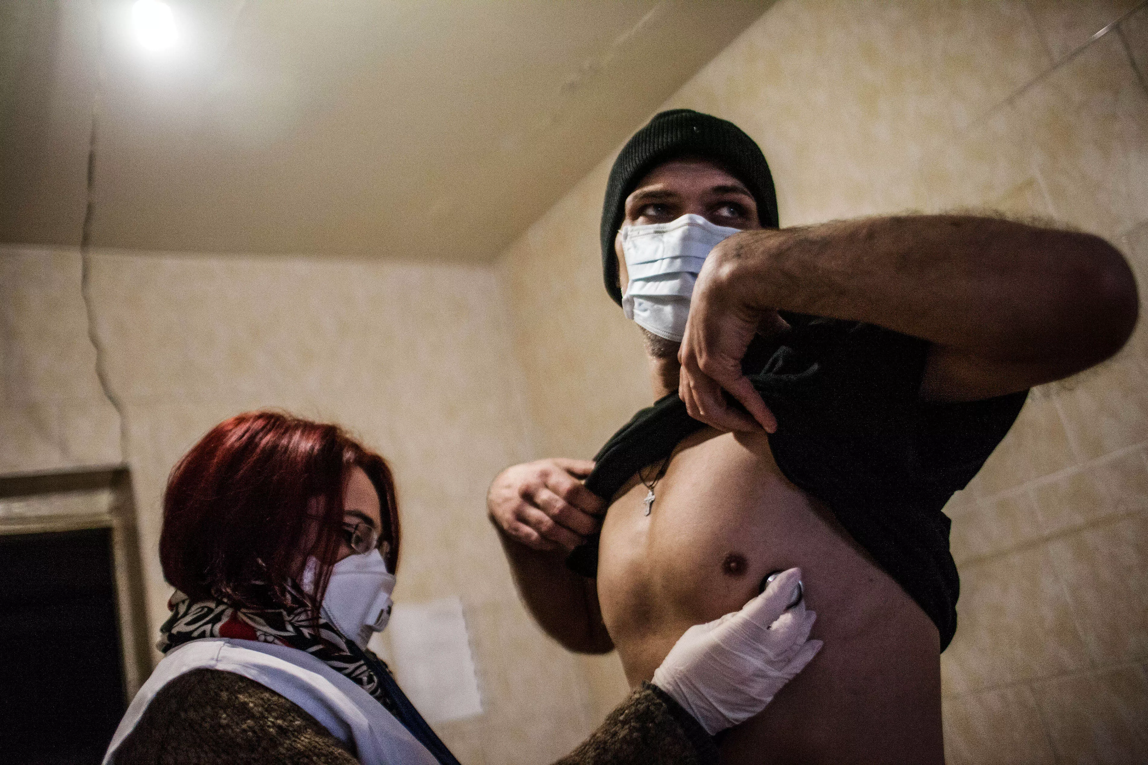 A patient infected with TB is treated by a member of MSF staff within a prison in Donetsk, Ukraine, where MSF is helping to treat patients infected with TB. 