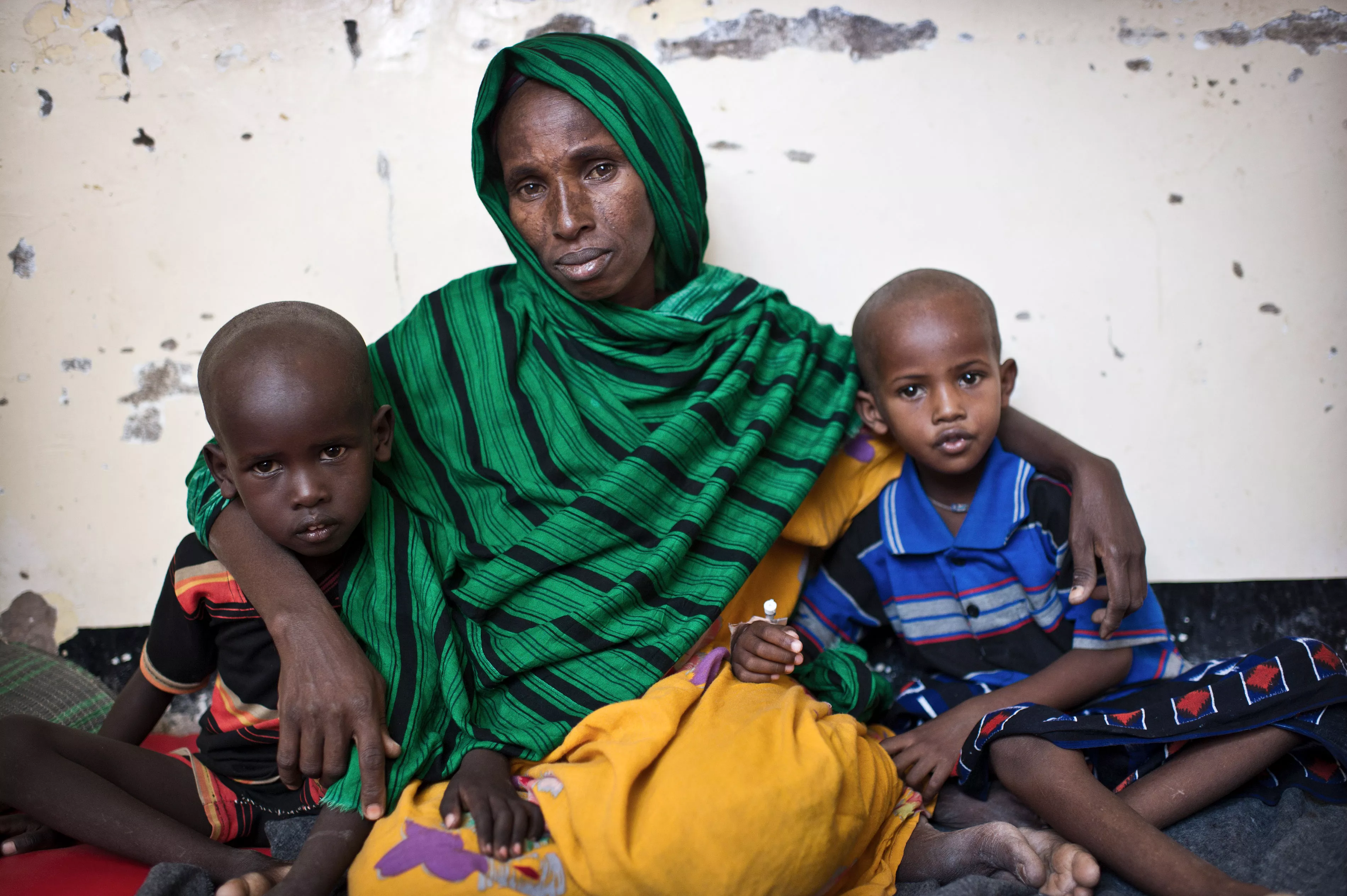 abiba Dahir Muse with her two sons Shafeer (4, left) and Abdikayr, (5, right). They came from Galgaduud region, about 160 kilometers from Galcayo. Her children were suffering from Diphtheria, two of her daughters died already. After their funeral she took the bus and brought her sons to the hospital. The transport money was collected among her community. After some days in isolation the boys are getting better and are now in the TFC (Therapeutic Feeding Centre) at the hospital MSF runs in Galcayo South. Hab